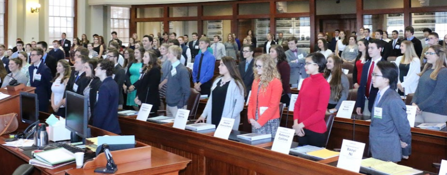 Participants of Model State stand in Maines House of Representatives. Credit to Fred Follansbee .